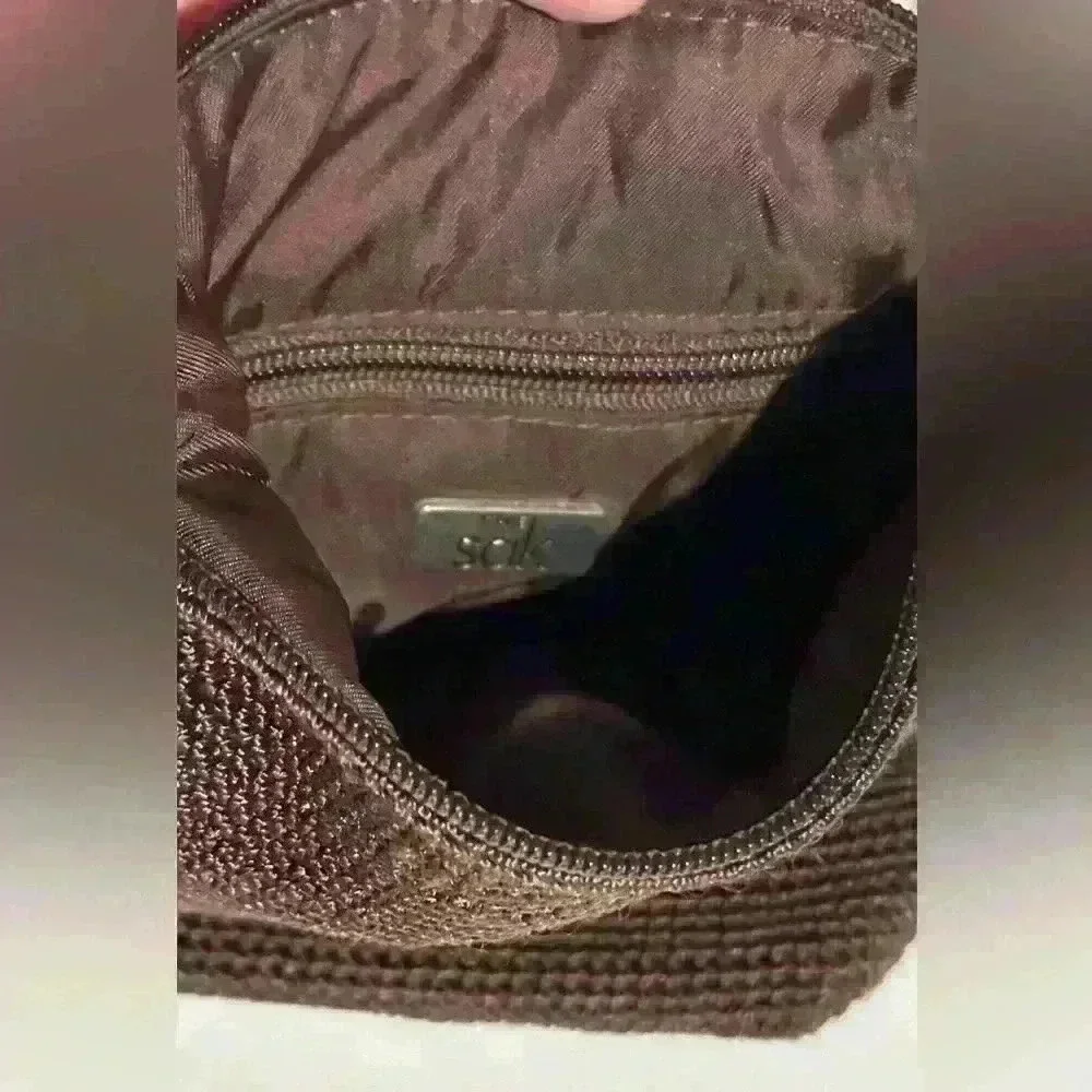 The Sak crochet brown woven shoulder bag / hobo handbag.
